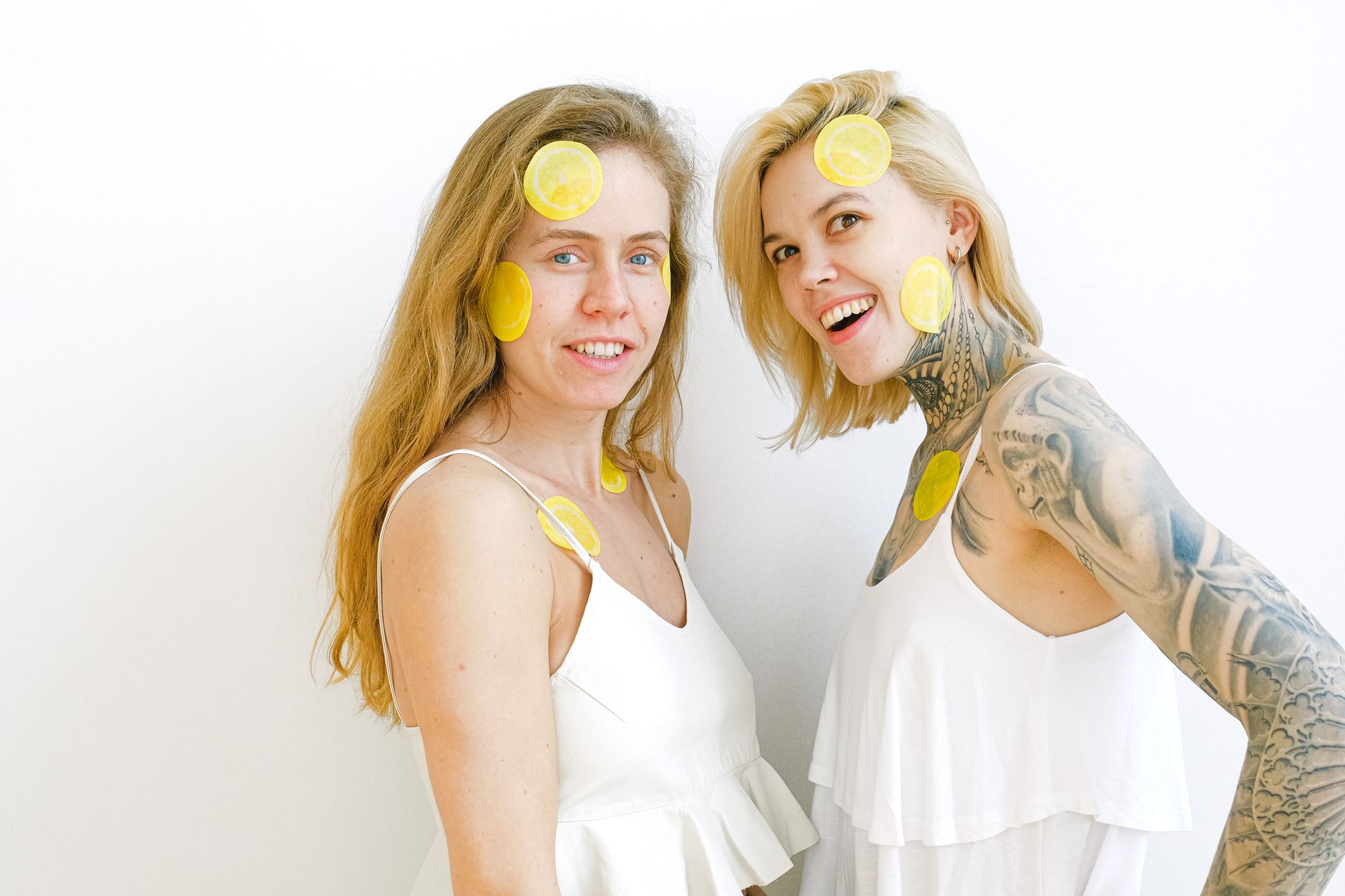 Two women laughing and having fun together indoors