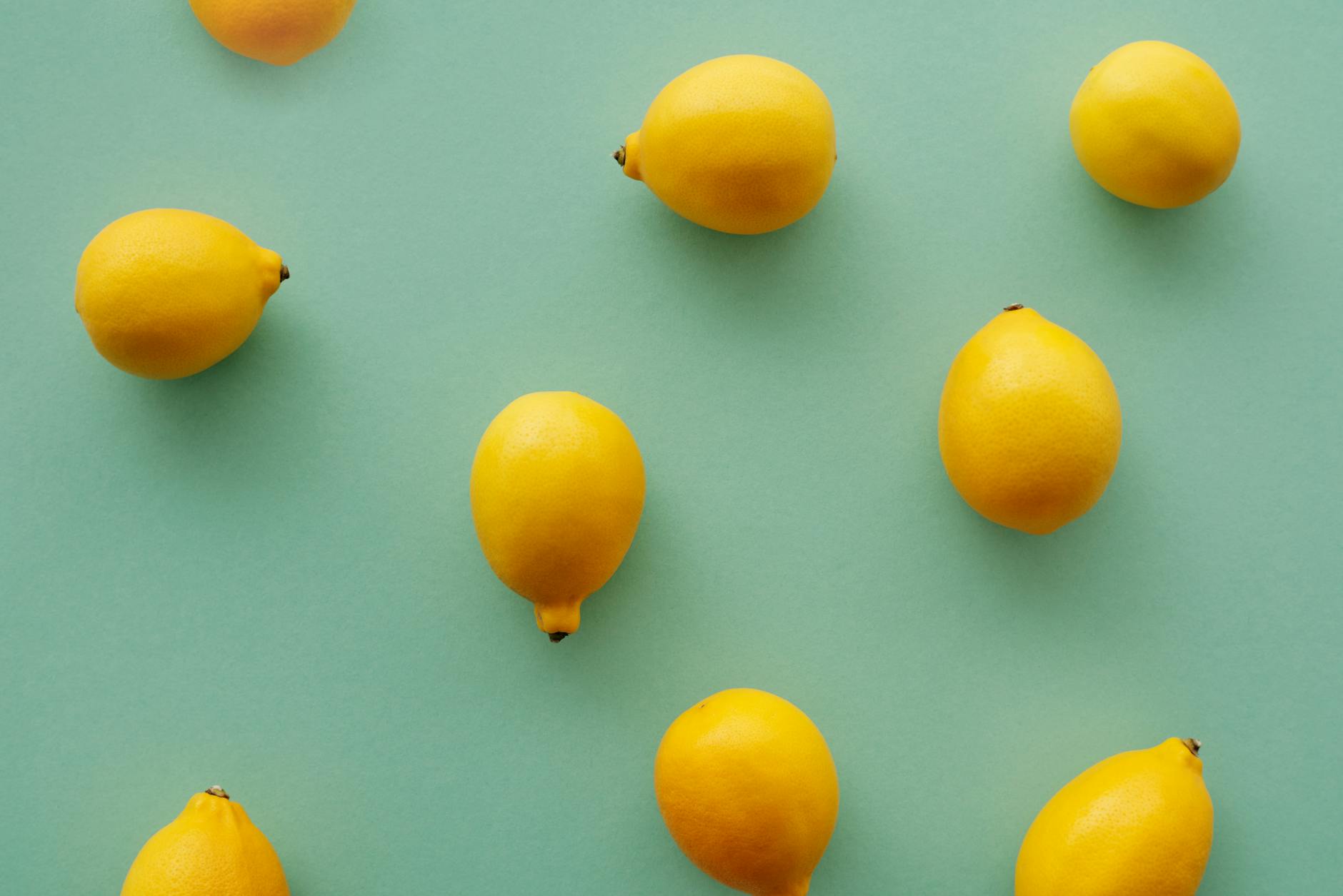 A yellow silicone vibrator surrounded by peeled bananas on a yellow background, representing gentle pleasure and body-safe design.
