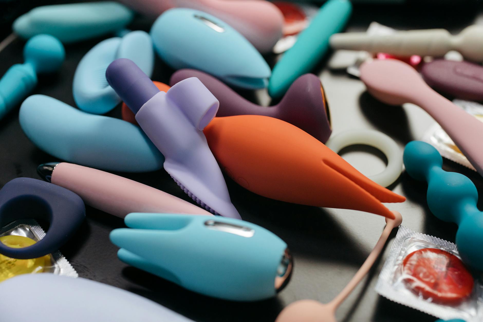 An array of vibrant lemon clitoral vibrators and adult toys in close-up view